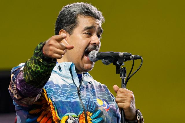 Venezuela's President Nicolas Maduro speaks to supporters during the closing campaign rally of the ruling United Socialist Party of Venezuela (PSUV) ahead of the parliamentary and regional election in Caracas on May 22, 2025. Venezuela will hold parliamentary and regional elections on May 25. (Photo by Pedro MATTEY / AFP)