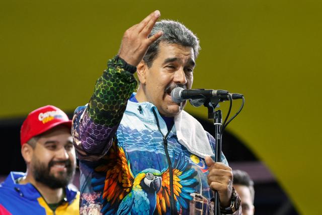 Venezuela's President Nicolas Maduro speaks to supporters during the closing campaign rally of the ruling United Socialist Party of Venezuela (PSUV) ahead of the parliamentary and regional election in Caracas on May 22, 2025. Venezuela will hold parliamentary and regional elections on May 25. (Photo by Pedro MATTEY / AFP)