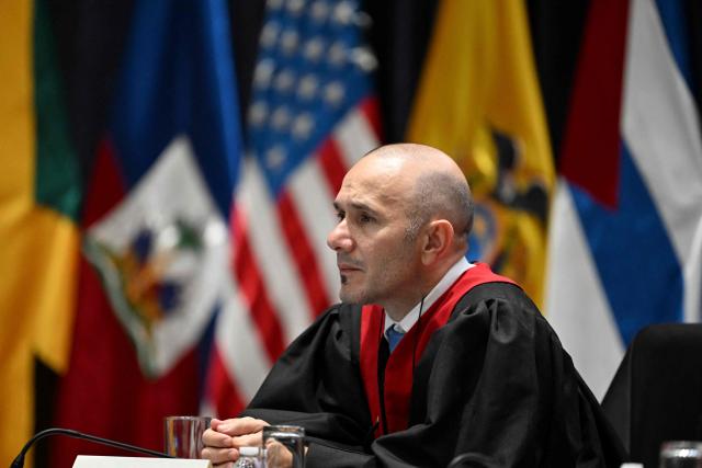 Paraguayan Judge Diego Moreno of the Inter-American Court of Human Rights attends a hearing in the case against Peru for the forced sterilization of a woman in 1997, which resulted in her death, in Guatemala City on May 22, 2025. (Photo by JOHAN ORDONEZ / AFP)