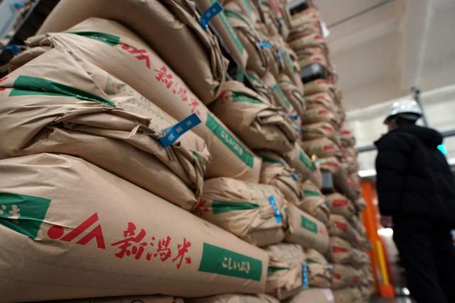 (FILES) This photo taken on March 7, 2025 shows government stockpiled rice in a warehouse in Kanagawa prefecture. Japan's core inflation rate accelerated in April to 3.5 percent as rice prices almost doubled year-on-year, official data showed on May 23. (Photo by Kazuhiro NOGI / AFP)