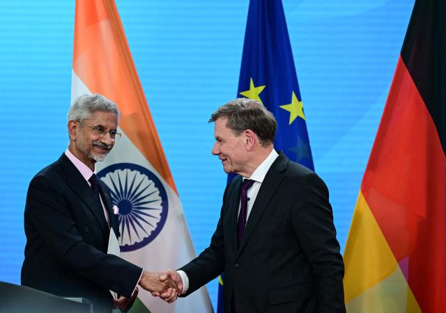 India's Minister of External Affairs Subrahmanyam Jaishankar (L) and German Minister for Foreign Affairs Johann Wadephul shake hands after a joint press conference in Berlin on May 23, 2025. (Photo by Tobias SCHWARZ / AFP)