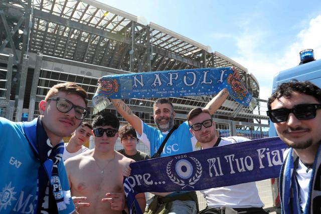 Supporters of Napoli pose before the Italian Serie A football match between Napoli and Cagliari outside the Diego Armando Maradona stadium in Naples on May 23, 2025. (Photo by Carlo Hermann / AFP)