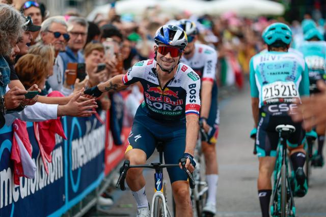 Red Bull-Bora-Hansgrohe's Slovenian rider Primoz Roglic greets the fans prior to the start of the 14th stage of the 108th Giro d'Italia cycling race of 195kms from Treviso in Italy to Nova Gorica in Slovenia on May 24, 2025. (Photo by Luca Bettini / AFP)