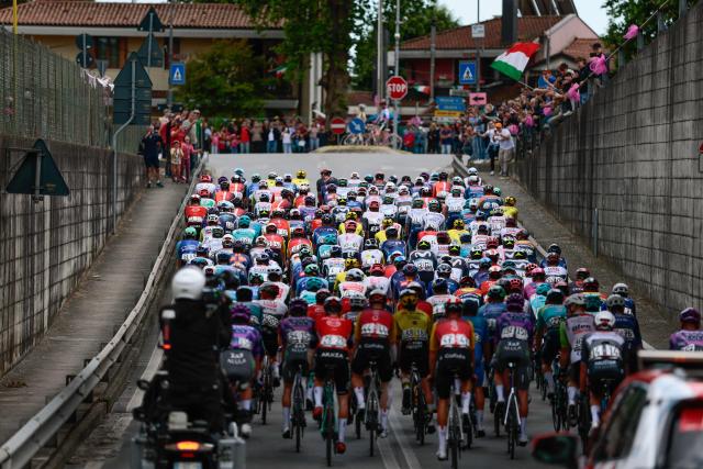 The peloton rides after the start of the 14th stage of the 108th Giro d'Italia cycling race of 195kms from Treviso in Italy to Nova Gorica in Slovenia on May 24, 2025. (Photo by Luca Bettini / AFP)