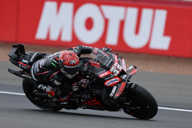 Aprilia Racing team's Italian MotoGP rider Lorenzo Savadori takes part in a practice session of the MotoGP British Grand Prix at Silverstone circuit in Northamptonshire, central England, on May 24, 2025. (Photo by Adrian Dennis / AFP)