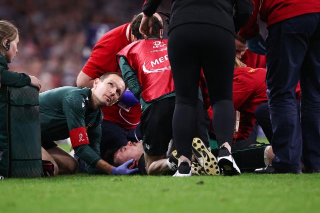 Northampton Saints' English full-back George Furbank receives medical attention during the Champions Cup Final rugby union match between Northampton Saints and Bordeaux-Begles at the Principality Stadium in Cardiff, south Wales, on May 24, 2025. (Photo by Anne-Christine POUJOULAT / AFP)