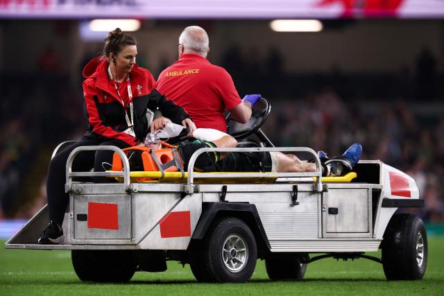 Northampton Saints' English full-back George Furbank is escoted out of a pitch on a stretcher during the Champions Cup Final rugby union match between Northampton Saints and Bordeaux-Begles at the Principality Stadium in Cardiff, south Wales, on May 24, 2025. (Photo by Anne-Christine POUJOULAT / AFP)