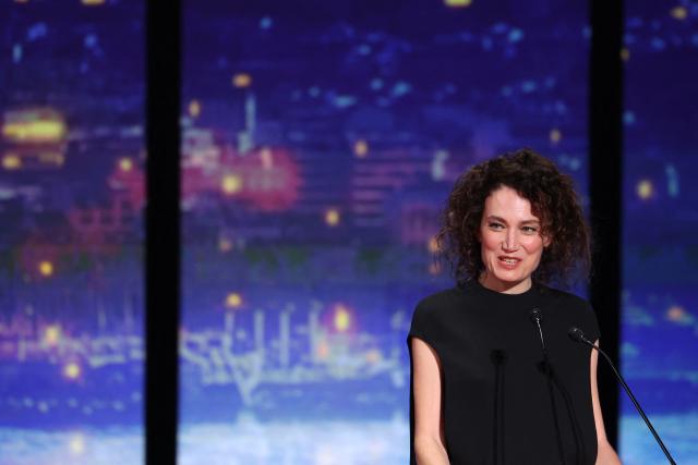 French director Coralie Fargeat presents the Grand Prix award during the closing ceremony at the 78th edition of the Cannes Film Festival in Cannes, southern France, on May 24, 2025. (Photo by Sameer AL-DOUMY / AFP)