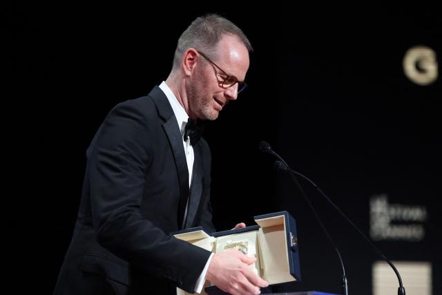 Norwegian director and screenwriter Joachim Trier delivers a speech on stage after winning the Grand Prix for the film Affeksjonsverdi" (Sentimental Value) during the closing ceremony at the 78th edition of the Cannes Film Festival in Cannes, southern France, on May 24, 2025. (Photo by Valery HACHE / AFP)