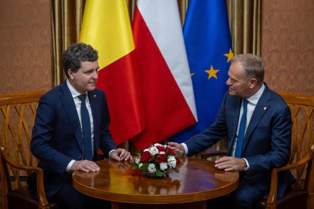 Poland's Prime Minister Donald Tusk (R) and Romania's President-elect Nicusor Dan have taken their seats for talks as they meet in Warsaw, Poland, on May 25, 2025. (Photo by Wojtek RADWANSKI / AFP)