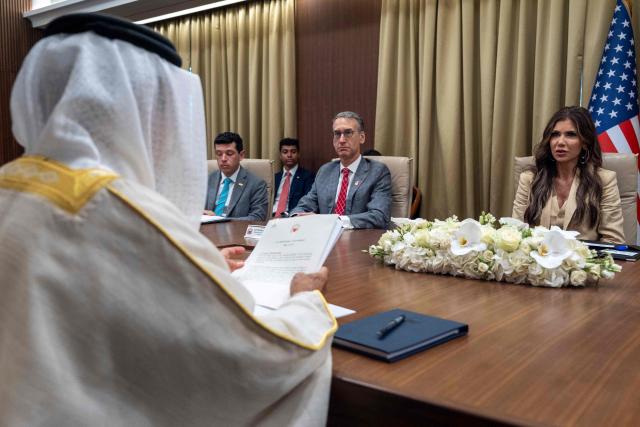 US Homeland Security Secretary Kristi Noem (R) meets with Bahrain's Minister of the Interior Rashid bin Abdullah al-Khalifa (L) in Manama on May 25, 2025. (Photo by Alex Brandon / POOL / AFP)
