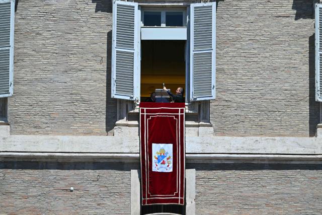 A technician prepares the microphone for the Regina Caeli prayer that will be delivered by Pope Leo XIV at St Peter's square in The Vatican on May 25, 2025. (Photo by Andreas SOLARO / AFP)