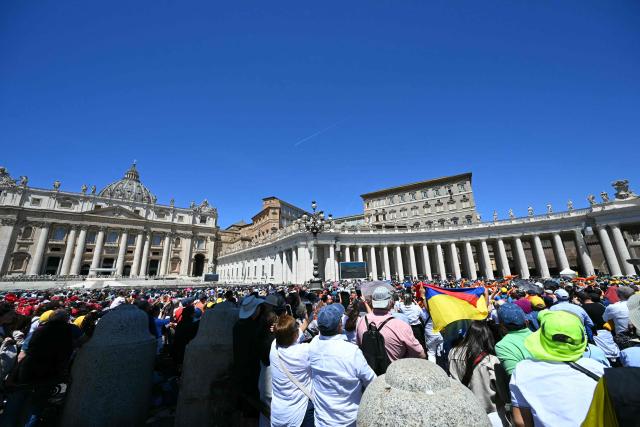 People gather for the Regina Caeli prayer at St Peter's square in The Vatican on May 25, 2025. (Photo by Andreas SOLARO / AFP)