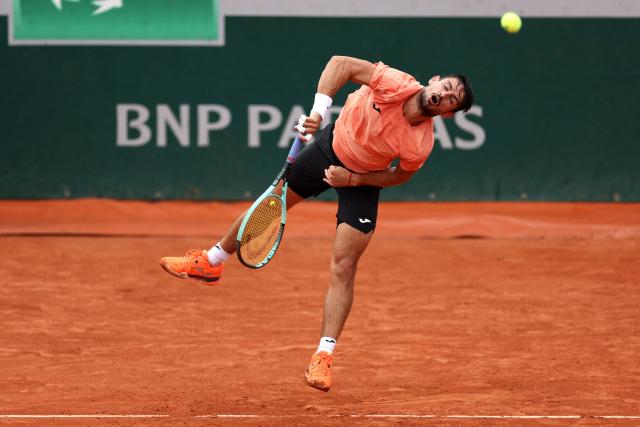 Argentina's Mariano Navone serves to US Brandon Nakashima during their men's singles match on day 1 of the French Open tennis tournament at the Roland-Garros Complex in Paris on May 25, 2025. (Photo by Franck FIFE / AFP)