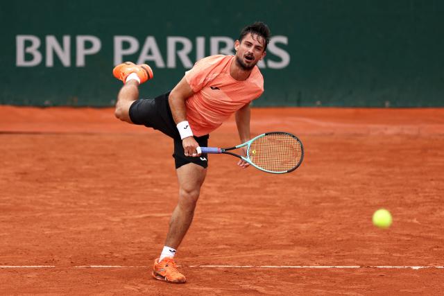 Argentina's Mariano Navone serves to US Brandon Nakashima during their men's singles match on day 1 of the French Open tennis tournament at the Roland-Garros Complex in Paris on May 25, 2025. (Photo by Franck FIFE / AFP)