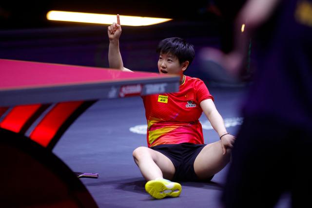 China's Sun Yingsha reacts after winning the women's single final match of the ITTF World Table Tennis Championships finals in Doha on May 25, 2025. (Photo by Karim JAAFAR / AFP)