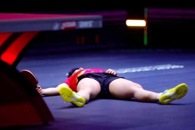 China's Sun Yingsha reacts after winning the women's single final match of the ITTF World Table Tennis Championships finals in Doha on May 25, 2025. (Photo by Karim JAAFAR / AFP)