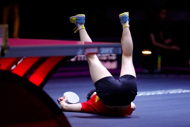 China's Sun Yingsha reacts after winning the women's single final match of the ITTF World Table Tennis Championships finals in Doha on May 25, 2025. (Photo by Karim JAAFAR / AFP)