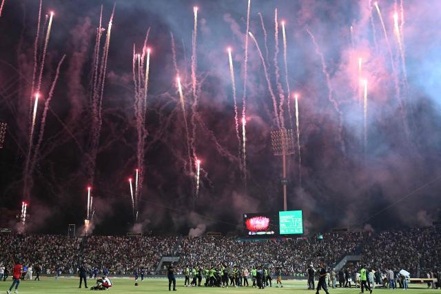 Lahore Qalanders' players celebrate their victory at the end of the Pakistan Super League (PSL) Twenty20 final cricket match between Lahore Qalandars and Quetta Gladiators at the Gaddafi Stadium in Lahore on May 25, 2025. (Photo by Aamir QURESHI / AFP)