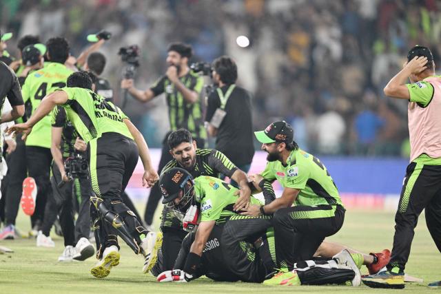 Lahore Qalanders' players celebrate their victory at the end of the Pakistan Super League (PSL) Twenty20 final cricket match between Lahore Qalandars and Quetta Gladiators at the Gaddafi Stadium in Lahore on May 25, 2025. (Photo by Aamir QURESHI / AFP)