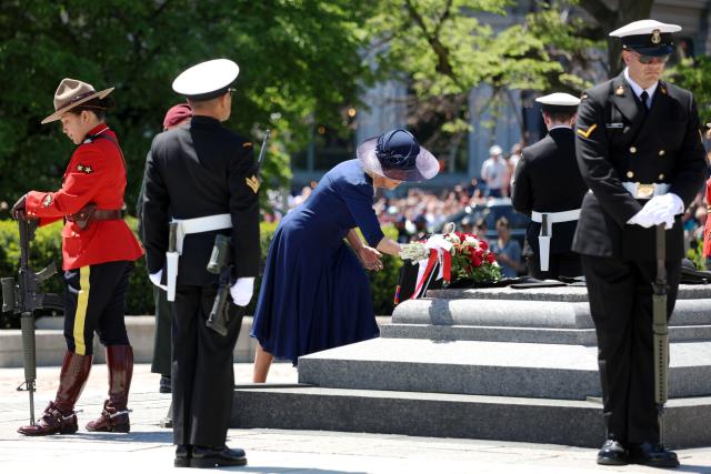 Britain's Queen Camilla lays a wreath at The Tomb of the Unknown Soldier at the National War Memorial in Ottawa, Canada on May 27, 2025. King Charles III was given an enthusiastic welcome on May 26 by Canadians who turned out in droves to see their monarch on his historic visit to open parliament, as part of the pushback against US President Donald Trump's annexation threats. The 76-year-old king, who is Canada's head of state as part of the Commonwealth, was greeted at the airport by Prime Minister Mark Carney, who has invited him to give an address opening Canada's new legislature on May 27. (Photo by Dave Chan / AFP)