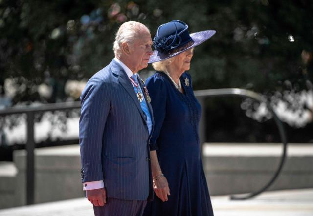Britain's King Charles III and Queen Camilla arrive to lay a wreath at The Tomb of the Unknown Soldier at the National War Memorial in Ottawa, Canada on May 27, 2025. King Charles III was given an enthusiastic welcome on May 26 by Canadians who turned out in droves to see their monarch on his historic visit to open parliament, as part of the pushback against US President Donald Trump's annexation threats. The 76-year-old king, who is Canada's head of state as part of the Commonwealth, was greeted at the airport by Prime Minister Mark Carney, who has invited him to give an address opening Canada's new legislature on May 27. (Photo by ANDREJ IVANOV / AFP)