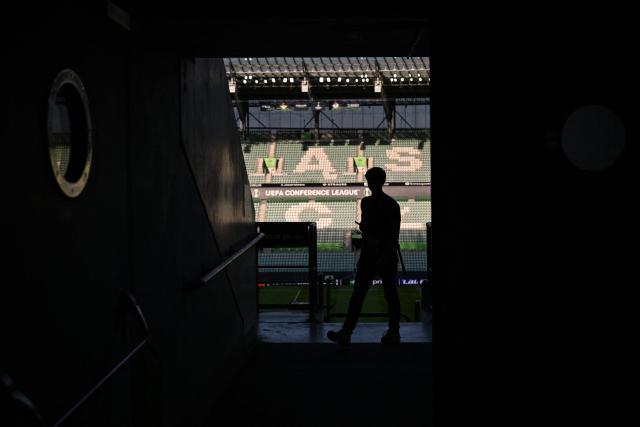 A journalists walks in the Wroclaw stadium on the eve of the UEFA Conference League Final between Real Betis and Chelsea FC in Wroclaw on May 27, 2025. (Photo by Sergei GAPON / AFP)