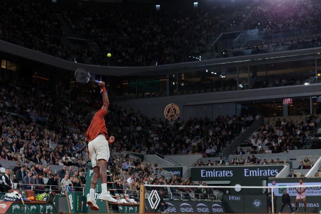 France's Gael Monfils serves to Bolivia's Hugo Dellien during their men's singles match on day 3 of the French Open tennis tournament on Court Philippe-Chatrier at the Roland-Garros Complex in Paris on May 27, 2025. (Photo by FRANCK FIFE / AFP)