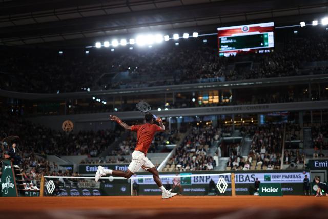 France's Gael Monfils plays a forehand return to Bolivia's Hugo Dellien during their men's singles match on day 3 of the French Open tennis tournament on Court Philippe-Chatrier at the Roland-Garros Complex in Paris on May 27, 2025. (Photo by FRANCK FIFE / AFP)