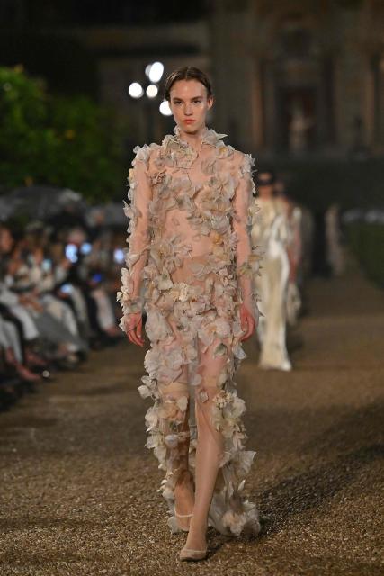 A model presents a creation during the Dior Women Cruise 26 fashion collection show at Villa Albani Torlonia, in Rome, on May 27, 2025. (Photo by Andreas SOLARO / AFP)