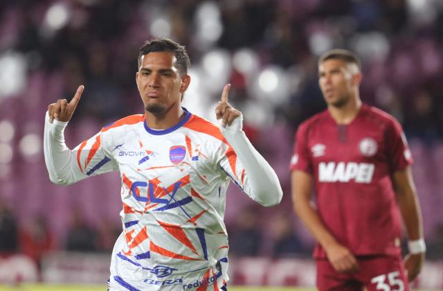 Puerto Cabello's forward #25 Junior Paredes celebrates scoring his team's first goal during the Copa Sudamericana group stage football match between Argentina's Lanus and Venezuela's Academia Puerto Cabello at the Ciudad de Lanus stadium, in Lanus, Buenos Aires province, Argentina, on May 27, 2025. (Photo by MARCOS BRINDICCI / AFP)