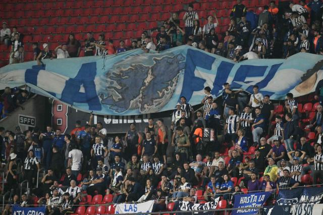 Fans of Talleres cheer for their team during the Copa Libertadores group stage football match between Brazil's Sao Paulo and Argentina's Talleres at the Morumbi stadium in Sao Paulo, Brazil on May 27, 2025. (Photo by NELSON ALMEIDA / AFP)