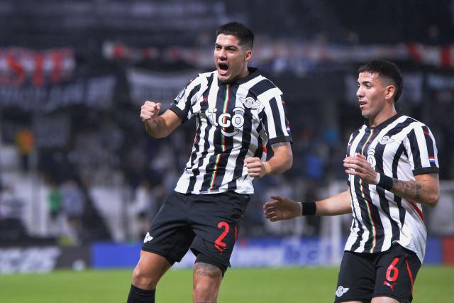 Libertad's defender #02 Ivan Ramirez (L) celebrates scoring his team's second goal next to teammate midfielder #06 Alvaro Campuzano during the Copa Libertadores group stage football match between Paraguay's Libertad and Peru's Alianza Lima at La Huerta stadium in Asuncion on May 27, 2025. (Photo by DANIEL DUARTE / AFP)
