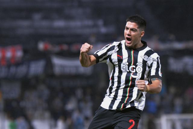 Libertad's defender #02 Ivan Ramirez celebrates scoring his team's second goal during the Copa Libertadores group stage football match between Paraguay's Libertad and Peru's Alianza Lima at La Huerta stadium in Asuncion on May 27, 2025. (Photo by DANIEL DUARTE / AFP)