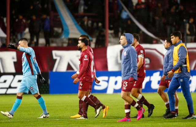 Players of Lanus leave the field at the end of the Copa Sudamericana group stage football match between Argentina's Lanus and Venezuela's Academia Puerto Cabello at the Ciudad de Lanus stadium, in Lanus, Buenos Aires province, Argentina, on May 27, 2025. (Photo by MARCOS BRINDICCI / AFP)