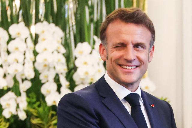 France's President Emmanuel Macron reacts as he shakes hands with Indonesia's President Prabowo Subianto during their meeting at Merdeka Palace in Jakarta on May 28, 2025. (Photo by Ludovic MARIN / AFP)