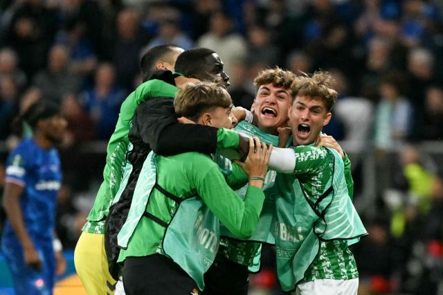Real Betis' players celebrate their team's first goal during the UEFA Conference League final football match between Real Betis and Chelsea FC in Wroclaw on May 28, 2025. (Photo by Sergei GAPON / AFP)