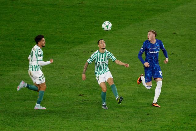 Chelsea's English midfielder #20 Cole Palmer (R) vies for the ball with Real Betis' Spanish midfielder #18 Pablo Fornals (L) and Real Betis' Brazilian midfielder #07 Antony during the UEFA Conference League final football match between Real Betis and Chelsea FC in Wroclaw on May 28, 2025. (Photo by Wojtek RADWANSKI / AFP)