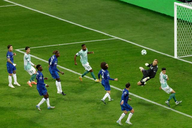 Chelsea's Swedish-Danish goalkeeper #12 Filip Jorgensen (2R) blocks the ball during the UEFA Conference League final football match between Real Betis and Chelsea FC in Wroclaw on May 28, 2025. (Photo by Wojtek RADWANSKI / AFP)