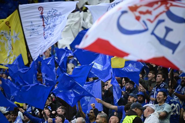 Chelsea's fans wave flags during the UEFA Conference League final football match between Real Betis and Chelsea FC in Wroclaw on May 28, 2025. (Photo by John MACDOUGALL / AFP)