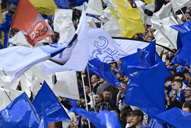 Chelsea's fans wave flags during the UEFA Conference League final football match between Real Betis and Chelsea FC in Wroclaw on May 28, 2025. (Photo by John MACDOUGALL / AFP)