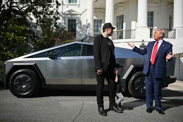 (FILES) US President Donald Trump and Tesla CEO Elon Musk speak to the press as they stand next to a Tesla Cybertruck on the South Portico of the White House on March 11, 2025 in Washington, DC. Billionaire Elon Musk on May 28, 2025 said he was leaving his position within the US government after leading the so-called Department of Government Efficiency in a controversial effort to slash federal spending. "As my scheduled time as a Special Government Employee comes to an end, I would like to thank President Donald Trump for the opportunity to reduce wasteful spending," he wrote on his social media platform X. (Photo by Mandel NGAN / AFP)