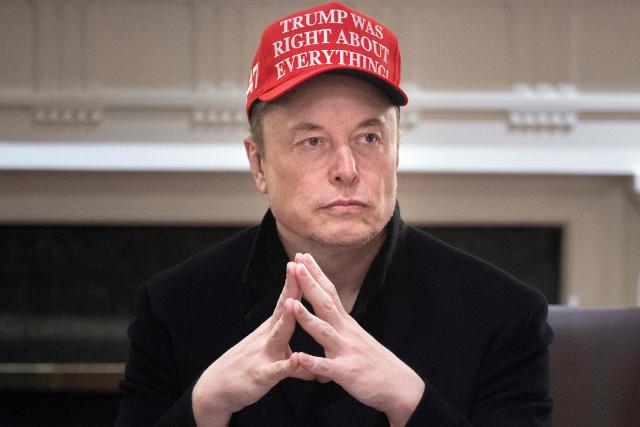 (FILES) Elon Musk looks on during a Cabinet Meeting in the Cabinet Room of the White House March 24, 2025 in Washington, DC. Elon Musk confirmed that he is leaving his US government role in a post on X (formerly Twitter) on May 28, 2025. (Photo by Brendan Smialowski / AFP)