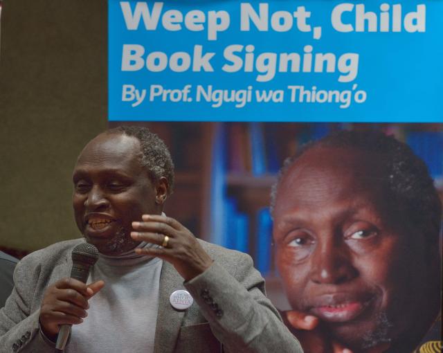 (FILES) Internationally celebrated author, playwright and critic, Kenyan Ngugi wa Thiong'o addresses fans on June 13, 2015 during a book signing to celebrate the golden jubilee of his first book 'Weep Not Child'  in the Kenyan capital, Nairobi. Kenyan author Ngugi wa Thiong'o, considered one of east Africa's greatest literary figures, died on May 29, 2025, his daughter announced on Facebook. He was 87. (Photo by TONY KARUMBA / AFP)