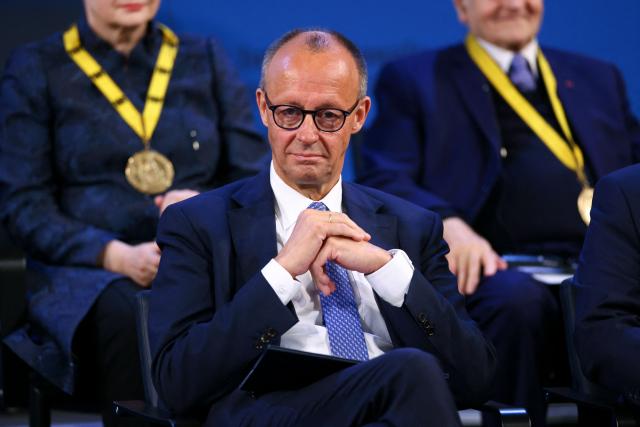 German Chancellor Friedrich Merz attends the award ceremony for the International Charlemagne Prize of Aachen 2025 (Karlspreis) to the European Commission President on May 29, 2025 in Aachen, western Germany. The International Charlemagne Prize of Aachen, the oldest and best-known prize awarded for work done in the service of European unification, is awarded to European Commission President Ursula Von der Leyen. (Photo by Thilo Schmuelgen / POOL / AFP)