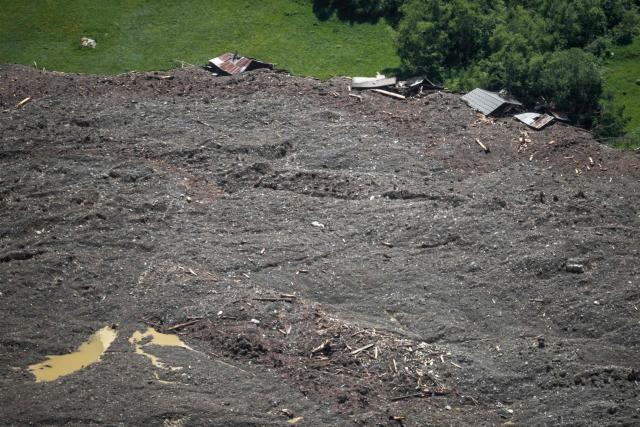 This photograph taken above Wiler shows the landslide after the huge Birch Glacier collapsed the day before and destroyed the evacuated small village of Blatten in the Swiss Alps, on May 29, 2025. Swiss authorities were on May 29, 2025 monitoring for possible flood risk in a southern valley, following a massive glacier collapse that created a huge pile of debris after destroying a small village. On May 28 the Birch glacier in Switzerland's southern Wallis region collapsed, sending tons of rock, ice and scree hurtling down the mountain slope and into the valley below. The barrage largely destroyed the hamlet of Blatten, which had been home to 300 people and was evacuated last week due to the impending danger. (Photo by FABRICE COFFRINI / AFP)