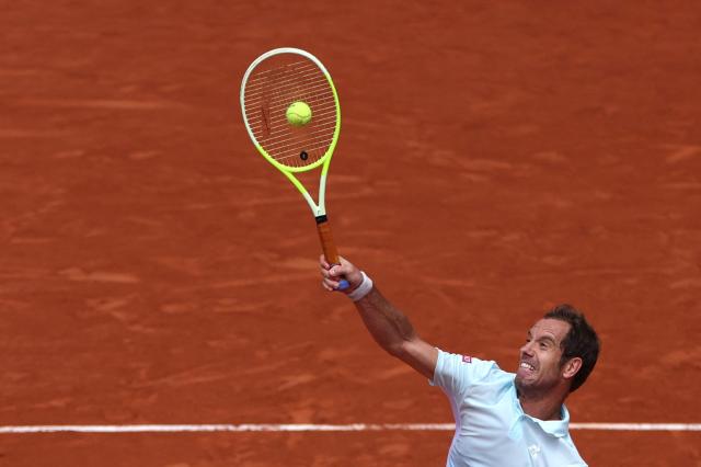 France's Richard Gasquet hits an overhead smash to Italy's Jannik Sinner during their men's singles match on day 5 of the French Open tennis tournament on Court Philippe-Chatrier at the Roland-Garros Complex in Paris on May 29, 2025. (Photo by ALAIN JOCARD / AFP)