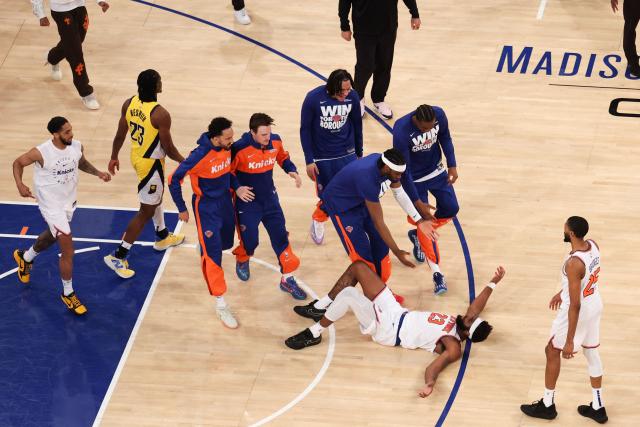 Knicks’ center #23 Mitchell Robinson is congratulated by teammates after scoring during Game Five of the Eastern Conference Finals of the 2025 NBA Playoffs between the New York Knicks and the Indiana Pacers at Madison Square Garden in New York on May 29, 2025. (Photo by CHARLY TRIBALLEAU / AFP)