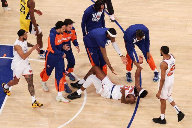 Knicks’ center #23 Mitchell Robinson is congratulated by teammates after scoring during Game Five of the Eastern Conference Finals of the 2025 NBA Playoffs between the New York Knicks and the Indiana Pacers at Madison Square Garden in New York on May 29, 2025. (Photo by CHARLY TRIBALLEAU / AFP)