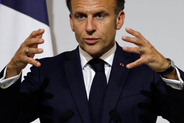 France's President Emmanuel Macron delivers an address during a reception for members of the French community at the International French School (IFS) in Singapore on May 30, 2025. (Photo by Ludovic MARIN / AFP)